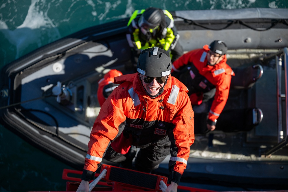 USCGC Polar Star (WAGB 10) conducts crew exchange in McMurdo Sound during Operation Deep Freeze