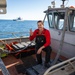 USCGC Polar Star (WAGB 10) conducts crew exchange in McMurdo Sound during Operation Deep Freeze
