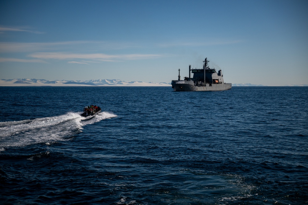 USCGC Polar Star (WAGB 10) conducts crew exchange in McMurdo Sound during Operation Deep Freeze