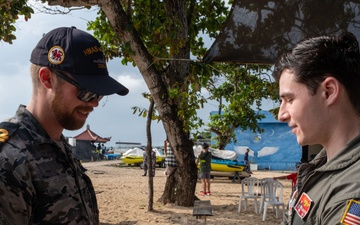 U.S. Navy Sailors release baby sea turtles into ocean during Multilateral Naval Exercise Komodo 2025 community relations project