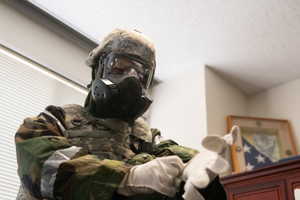 374 AW command team dons MOPP gear in preparation for BM 25-2