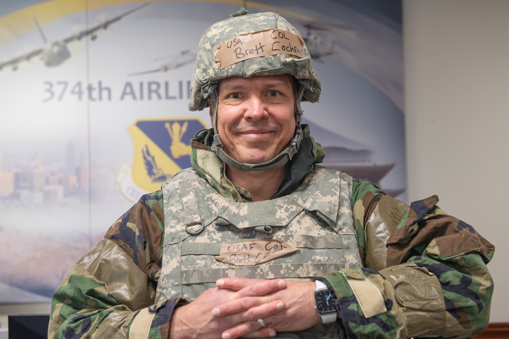 374 AW command team dons MOPP gear in preparation for BM 25-2