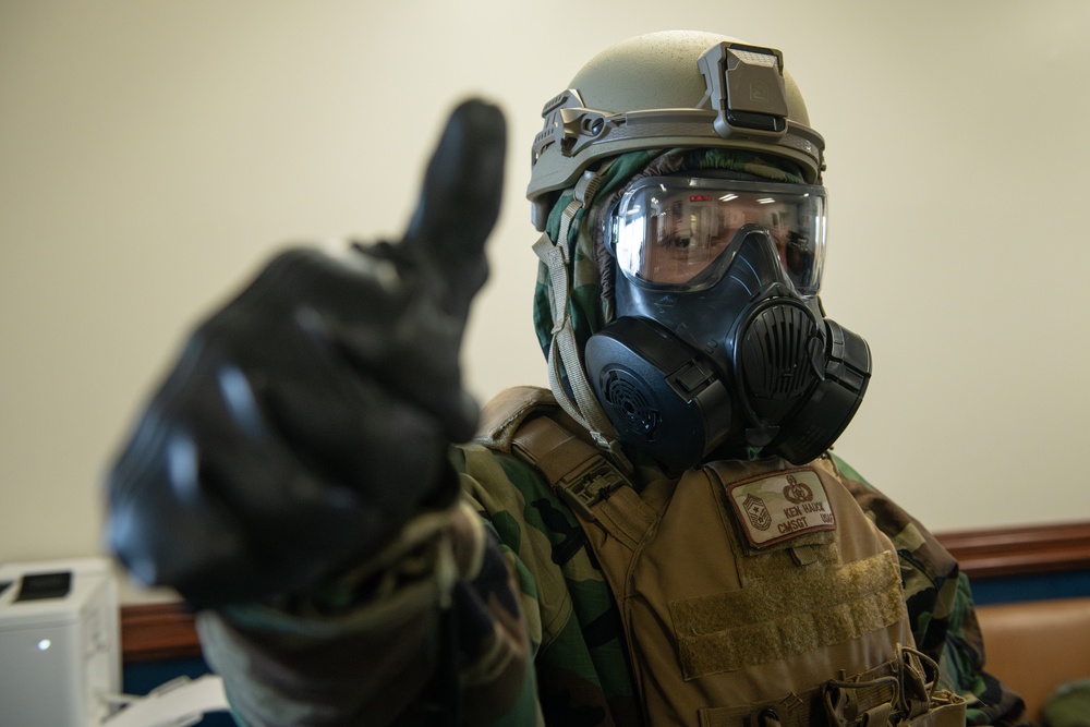 374 AW command team dons MOPP gear in preparation for BM 25-2
