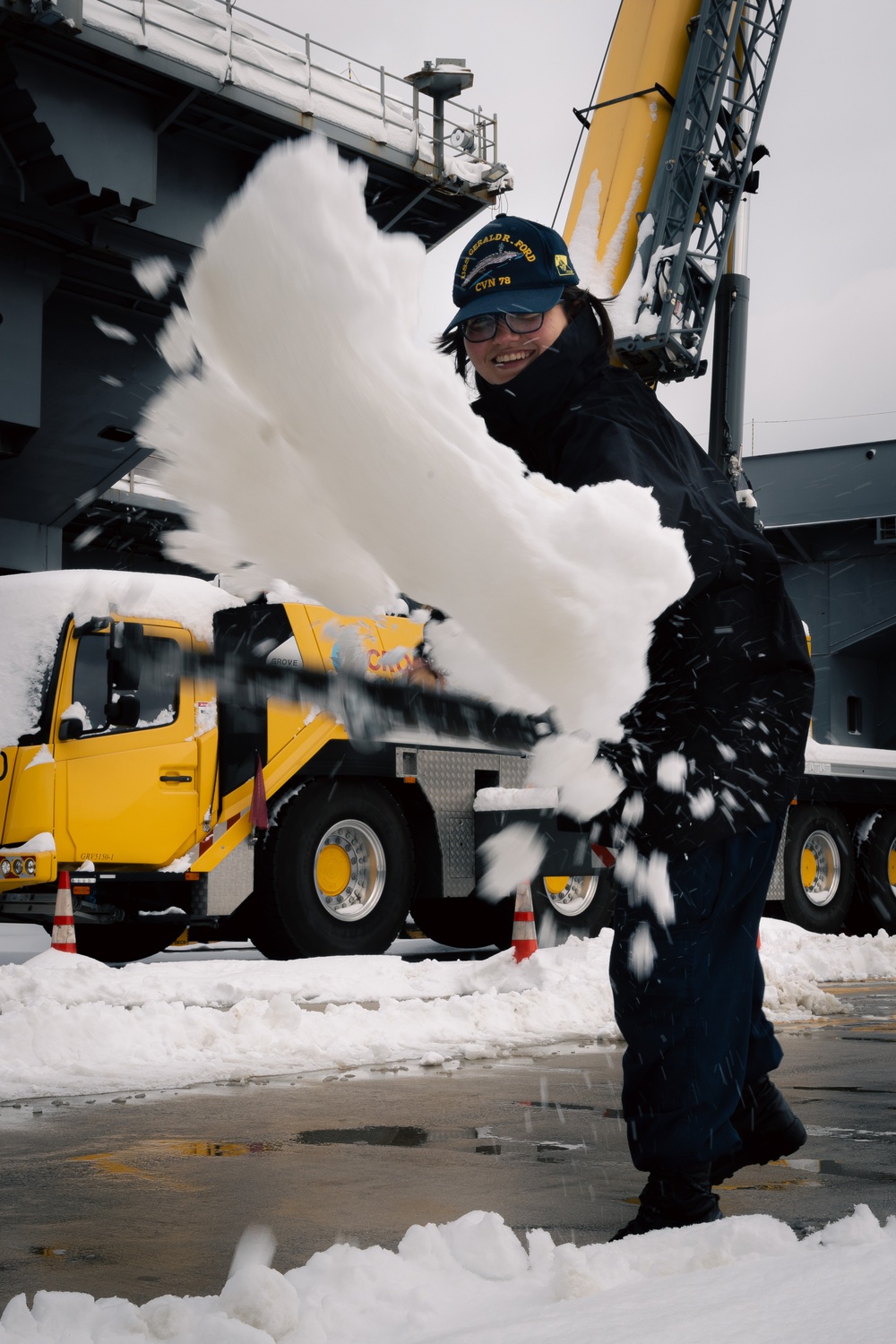 USS Gerald R. Ford (CVN 78) Sailors shovel snow during a winter storm