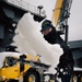 USS Gerald R. Ford (CVN 78) Sailors shovel snow during a winter storm