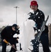 USS Gerald R. Ford (CVN 78) Sailors shovel snow during a winter storm