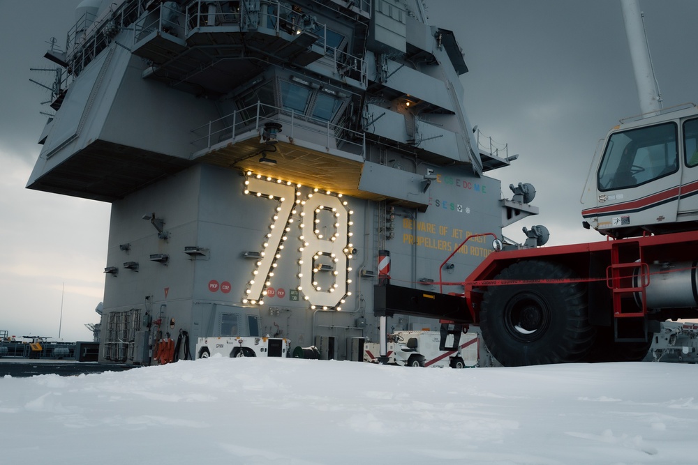 USS Gerald R. Ford (CVN 78) Sailors shovel snow during a winter storm