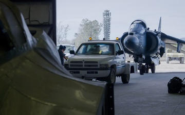 Marine Attack Squadron (VMA) 231 tows an AV-8B Harrier II to Pima Air and Space Museum