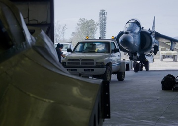 Marine Attack Squadron (VMA) 231 tows an AV-8B Harrier II to Pima Air and Space Museum