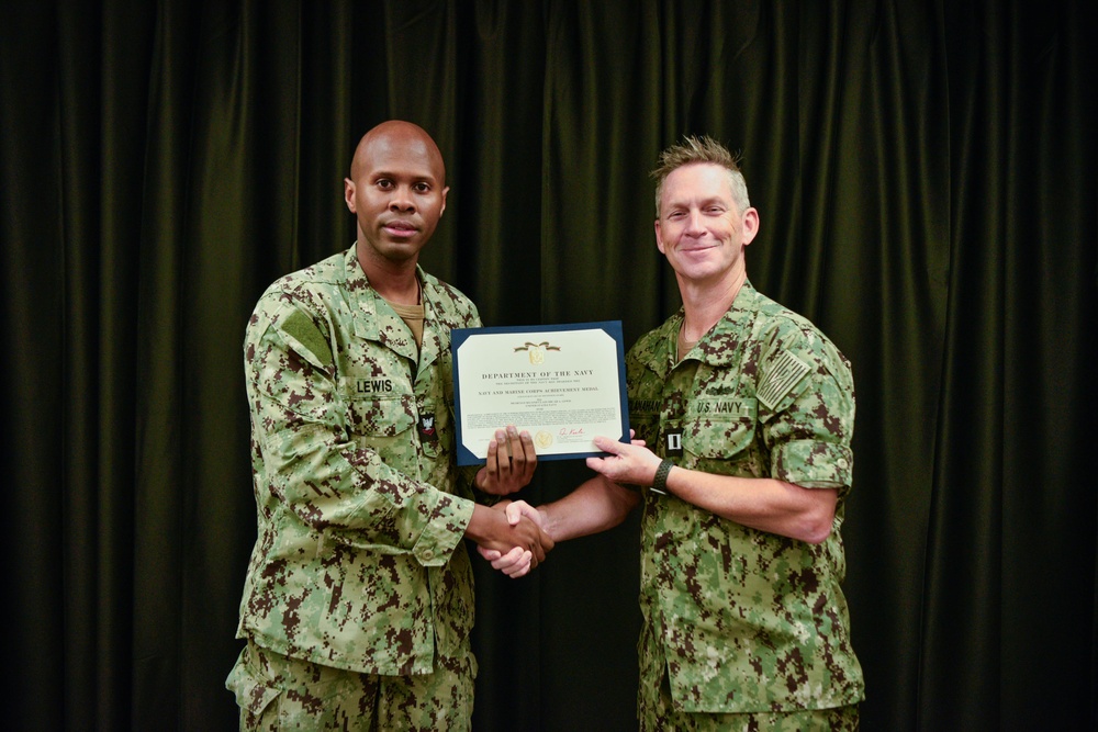 LT Clint McClanahan presents MU2 Micah Lewis with Navy and Marine Corps Achievement Medal