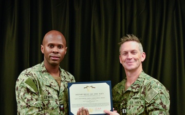 LT Clint McClanahan presents MU2 Micah Lewis with Navy and Marine Corps Achievement Medal