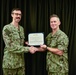 LT Clint McClanahan presents MU3 Erik Muench with Navy and Marine Corps Achievement Medal for his support of Pacific Partnership 2024-2