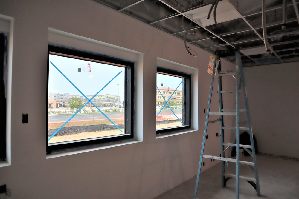 Taped Windows in a Police Station Under Construction on Camp Blaz show the Base in the Background