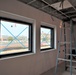 Taped Windows in a Police Station Under Construction on Camp Blaz show the Base in the Background