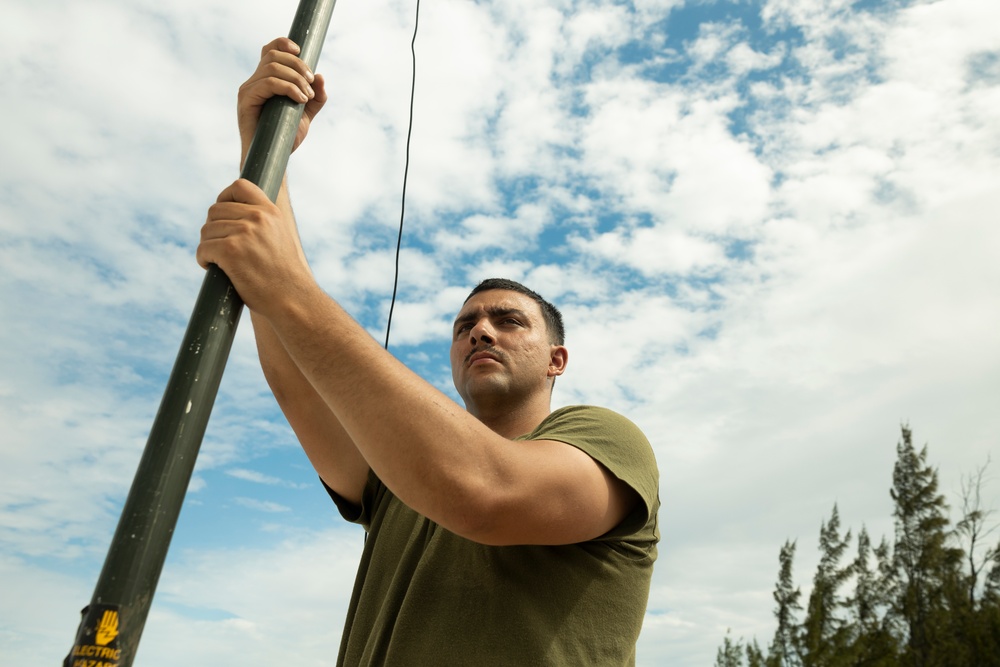 U.S. Marines with MACS-2 set up a field expedient high frequency antenna