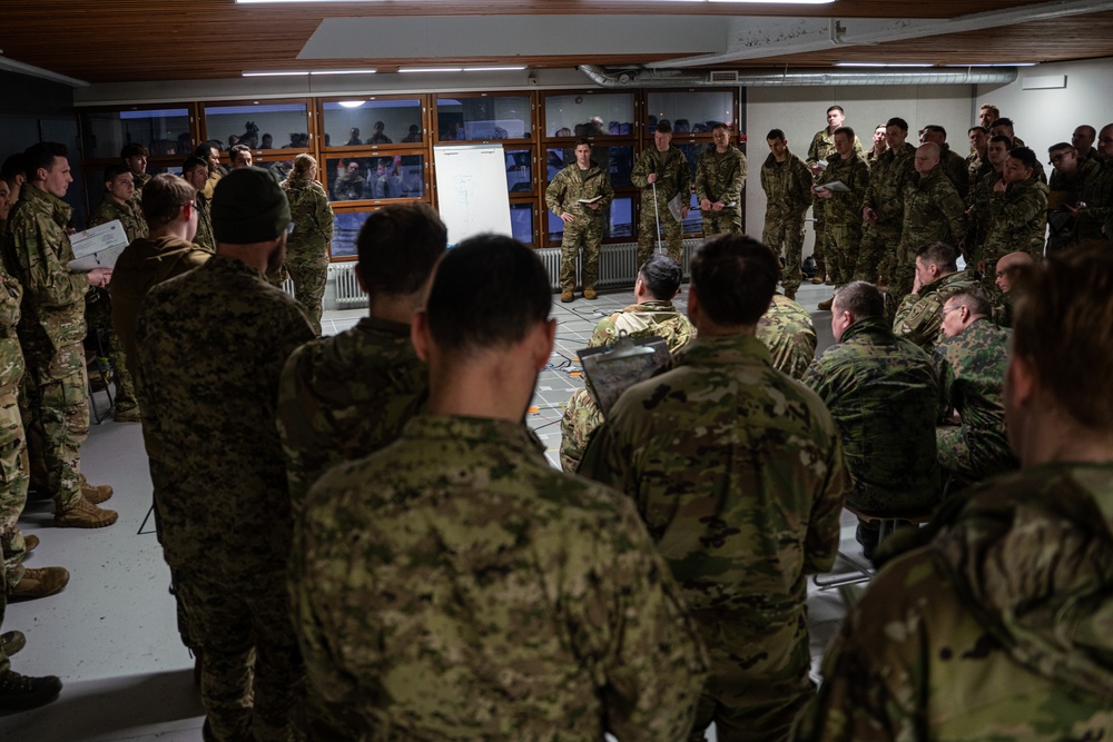 10th Mountain, 11th Airborne Division, Canadian and Finnish Soldiers Hold a Rehearsal of Concept Brief for Arctic Forge 25