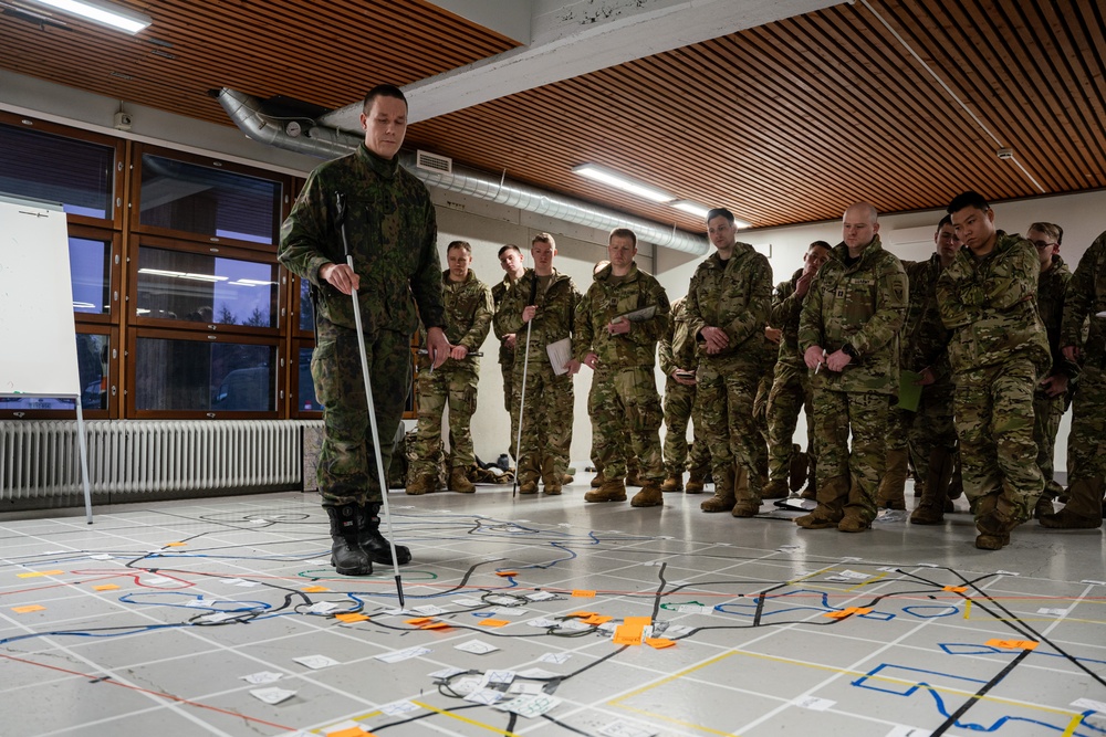 10th Mountain, 11th Airborne Division, Canadian and Finnish Soldiers Hold a Rehearsal of Concept Brief for Arctic Forge 25