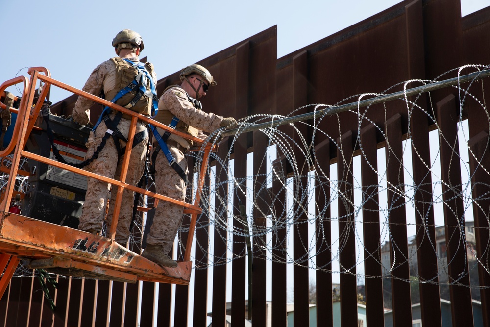 U.S. Marines mount concertina wire along southern border wall