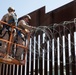 U.S. Marines mount concertina wire along southern border wall