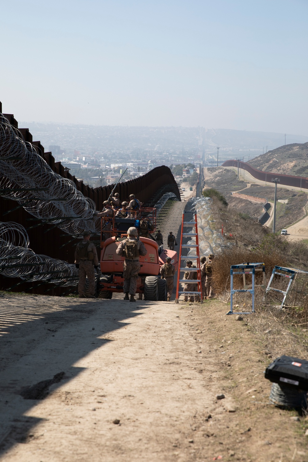 U.S. Marines mount concertina wire along southern border wall