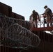U.S. Marines mount concertina wire along southern border wall
