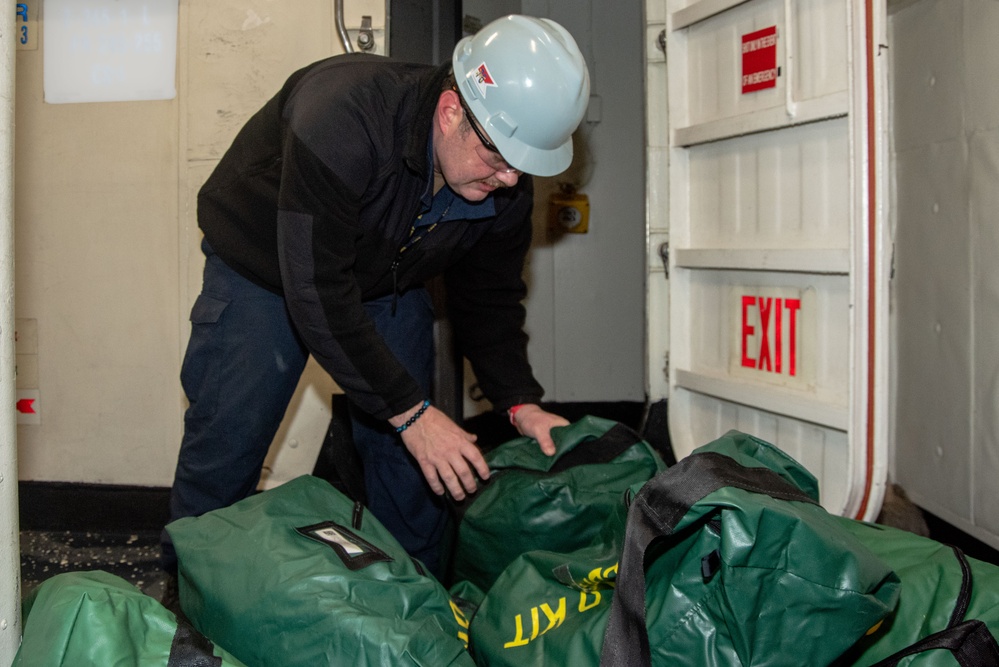 USS Ronald Reagan (CVN 76) Sailor transports CBR equipment