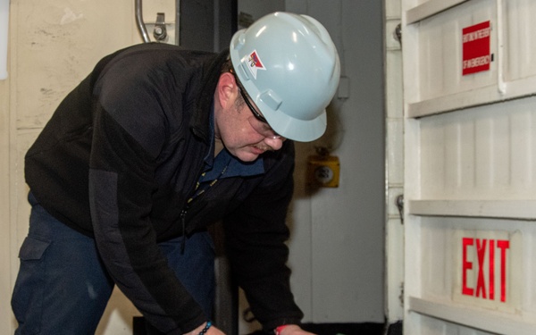 USS Ronald Reagan (CVN 76) Sailor transports CBR equipment