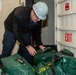 USS Ronald Reagan (CVN 76) Sailor transports CBR equipment