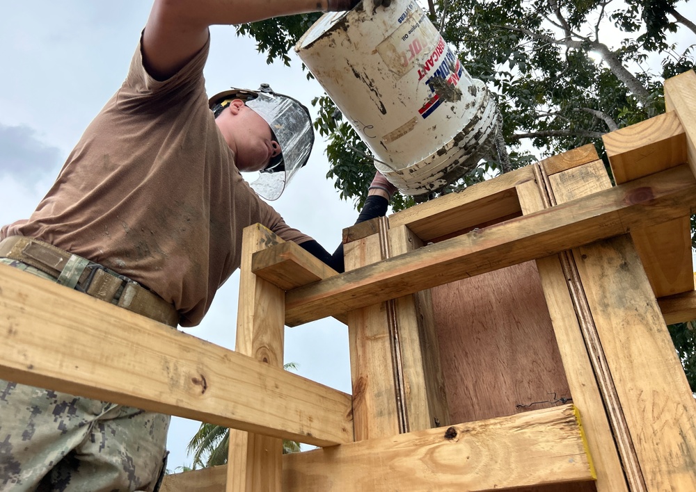 Placing concrete for schoolhouse