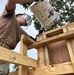 Placing concrete for schoolhouse