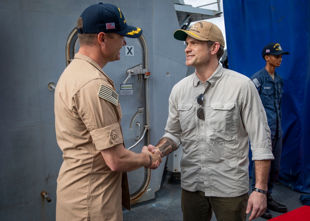 Secretary of Defense Pete Hegseth interacts with Sailors