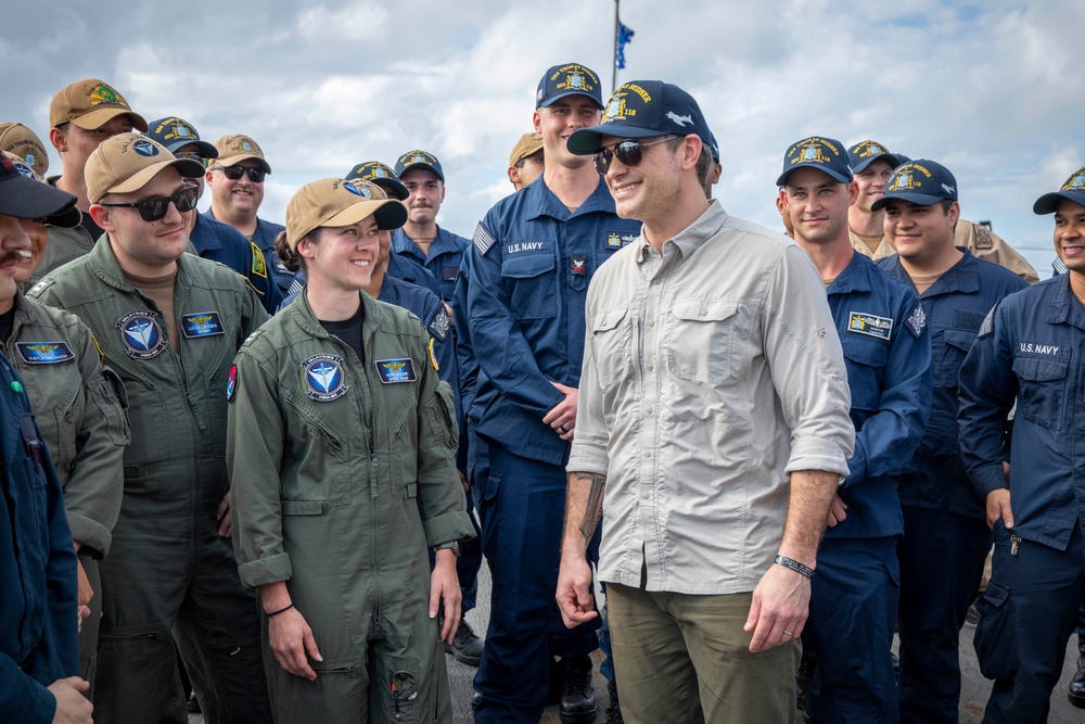 Secretary of Defense Pete Hegseth interacts with Sailors
