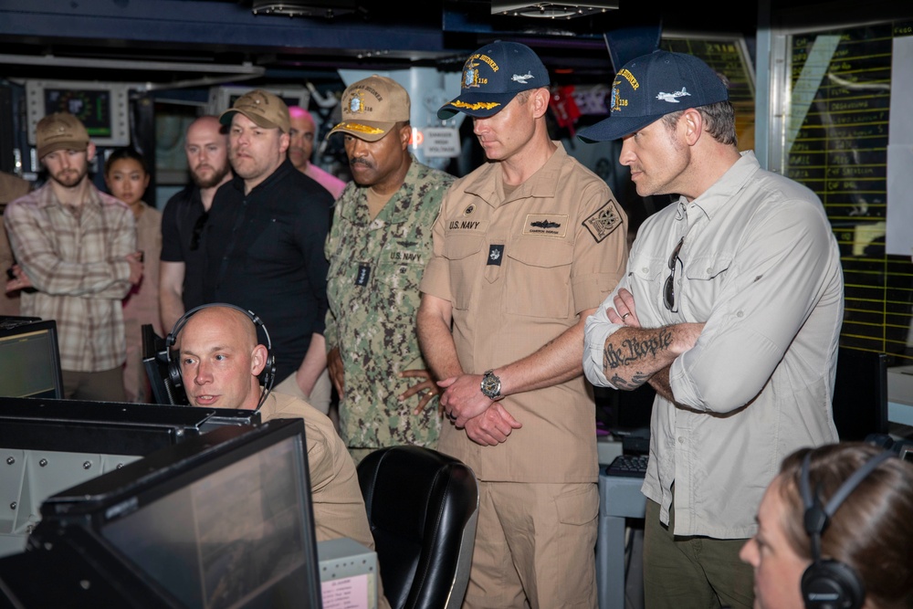 Secretary of Defense Pete Hegseth interacts with Sailors
