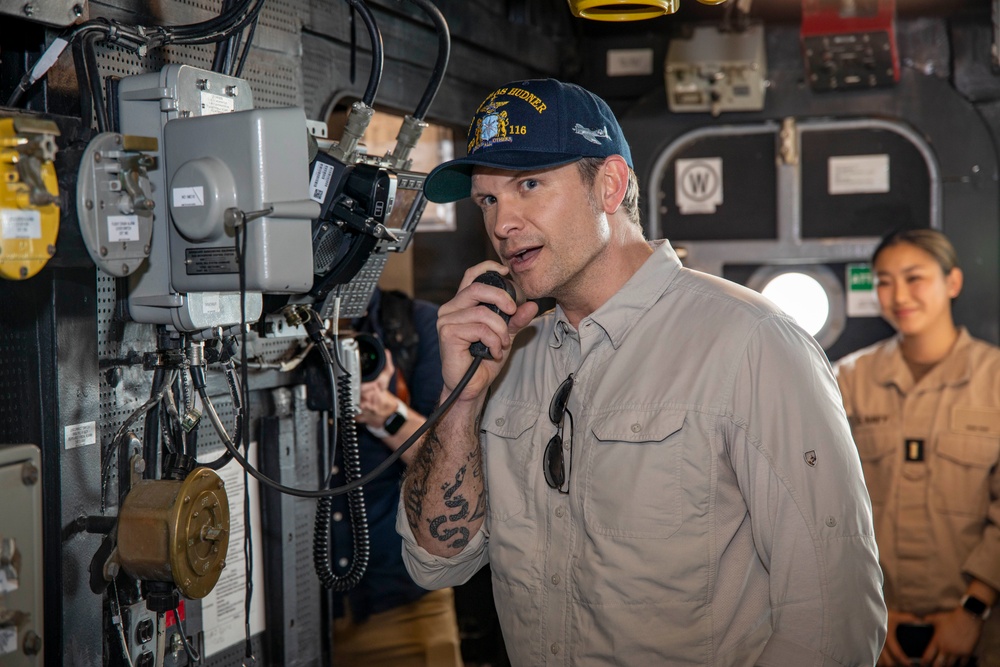 Secretary of Defense Pete Hegseth interacts with Sailors