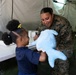 U.S. Marines and Sailors with II MEF engage in a medical and dental civil action program in The Bahamas