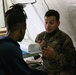 U.S. Marines and Sailors with II MEF engage in a medical and dental civil action program in The Bahamas