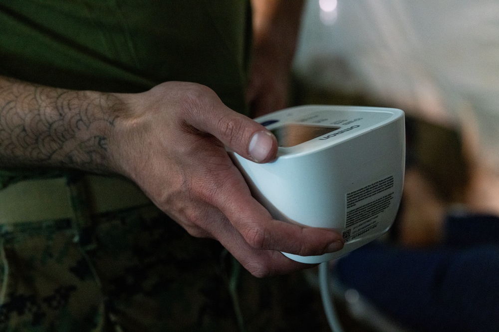 U.S. Marines and Sailors with II MEF engage in a medical and dental civil action program in The Bahamas