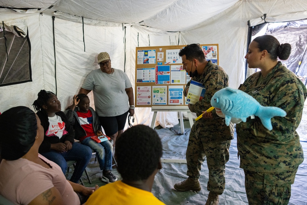 U.S. Marines and Sailors with II MEF engage in a medical and dental civil action program in The Bahamas