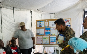 U.S. Marines and Sailors with II MEF engage in a medical and dental civil action program in The Bahamas