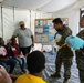 U.S. Marines and Sailors with II MEF engage in a medical and dental civil action program in The Bahamas