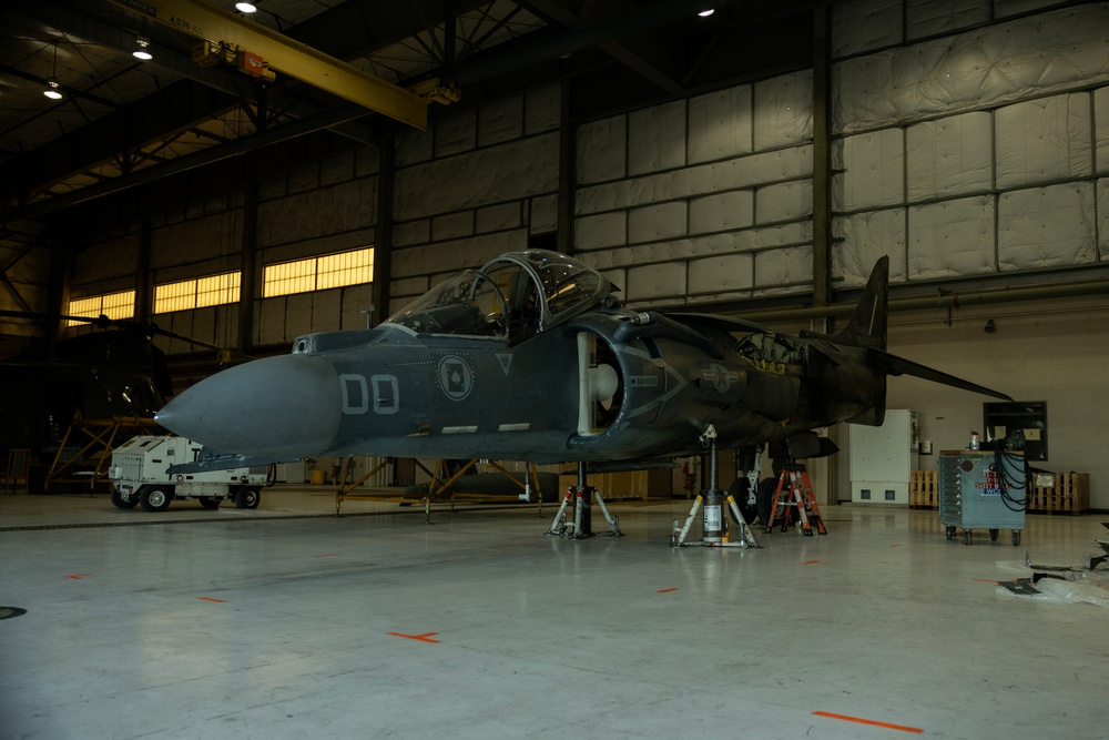 U.S. Marines with VMA-231 conduct maintenance on the AV-8B Harrier II