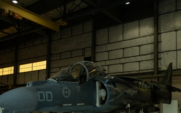 U.S. Marines with VMA-231 conduct maintenance on the AV-8B Harrier II