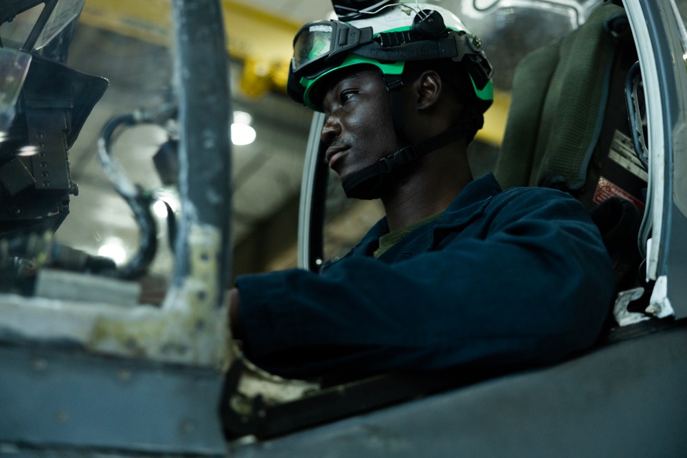 U.S. Marines with VMA-231 conduct maintenance on the AV-8B Harrier II