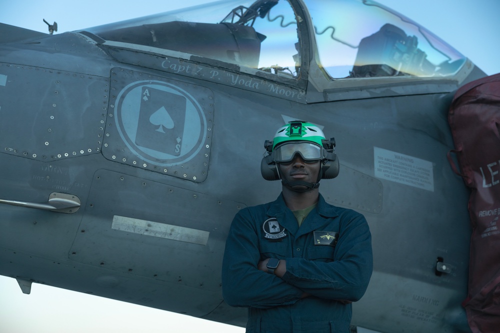 U.S. Marines with VMA-231 conduct maintenance on the AV-8B Harrier II