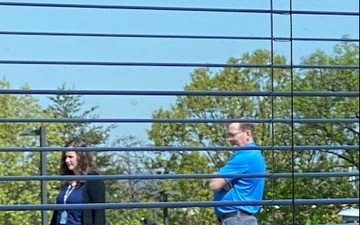 Employees Documenting an Event from the Roof