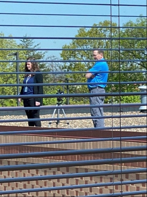 Employees Documenting an Event from the Roof