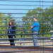 Employees Documenting an Event from the Roof