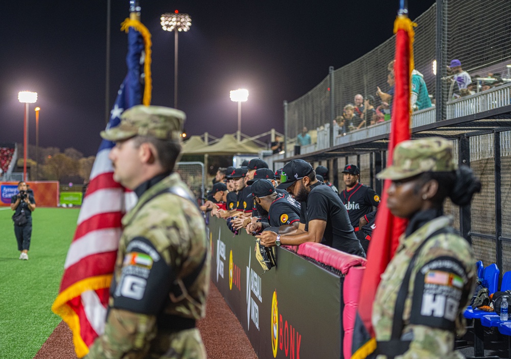 The 380th AEW Honor Guard presents the colors at a Baseball United game