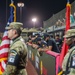 The 380th AEW Honor Guard presents the colors at a Baseball United game