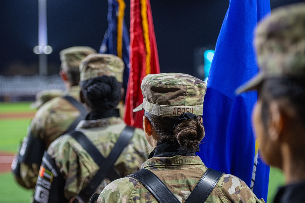 The 380th AEW Honor Guard presents the colors at a Baseball United game